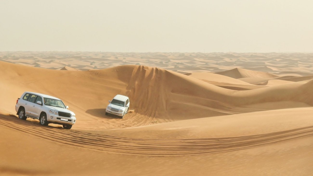 Drivers are driving in the desert