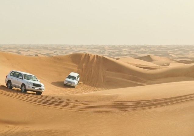 Drivers are driving in the desert