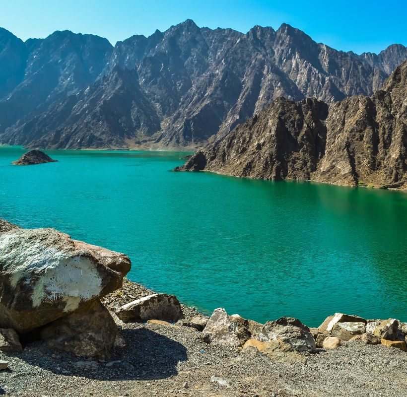 a rocky mountains and a lake of water