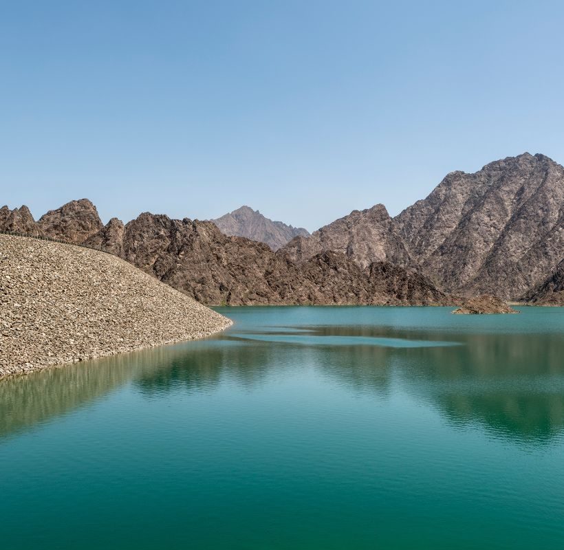 Water with rocky hills in the background